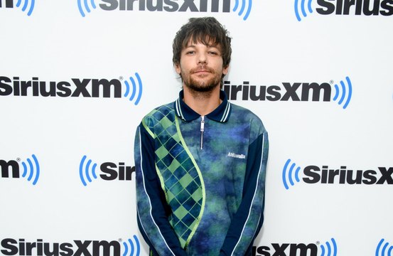 Louis Tomlinson no longer feels like he's in competition with his former One Direction bandmates