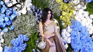 Mouni Roy looks Elegant and Enchanting in Gold saree paired with a Potli bag