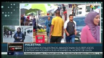 Palestinos abandonan sus refugios e intentan volver a sus hogares