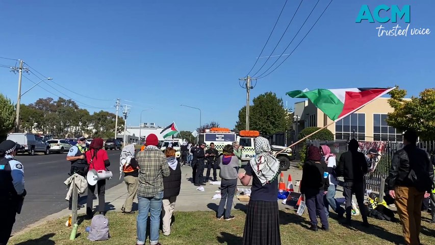 Pro-Palestine protesters assembled outside Electro Optic Systems (EOS) in Hume, ACT. ACT Policing officers arrested four of them when they chained themselves to the entry gates.