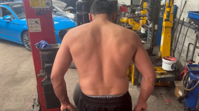 Doing shrugs and side workout with set of brake disc