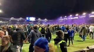 Fans storm the pitch after Pompey win