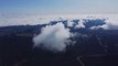 DJI Drone flight over 4500ft with the clouds at Montagne Saint-Pierre, Tour-Val-Marie, Tour du radar, Saint-Cleopphas, Vallée de la Matapédia, Québec, Canada.
