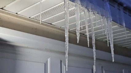 Considerate man takes time out of day to smash irky icicles
