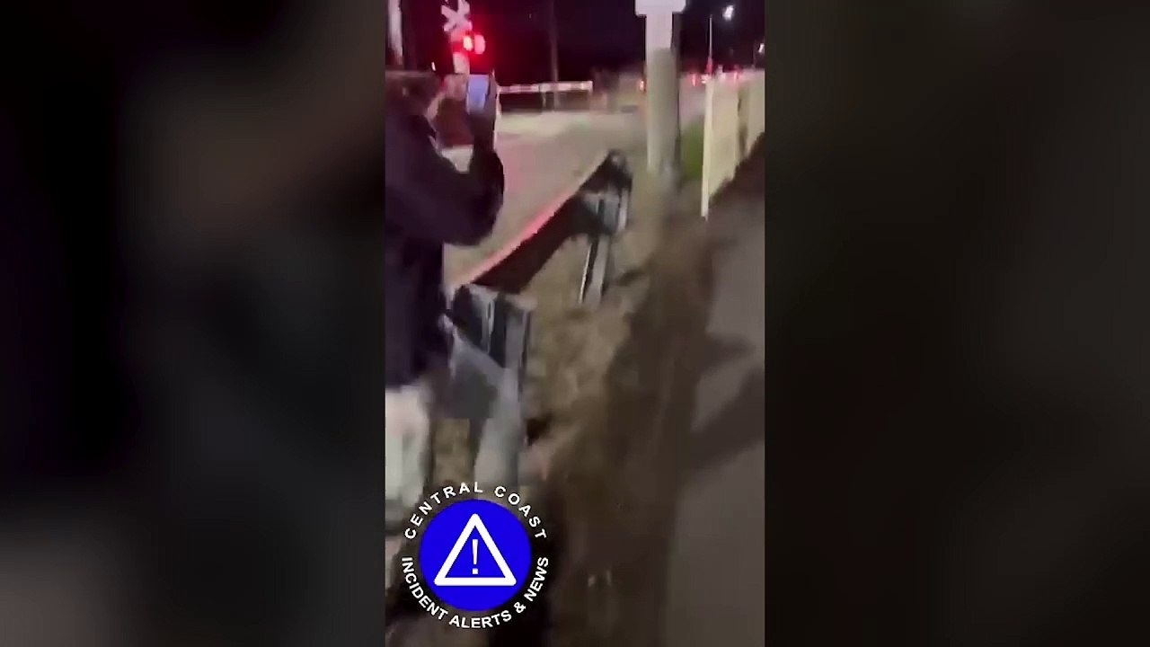 Train crashes into car on the tracks on a level...