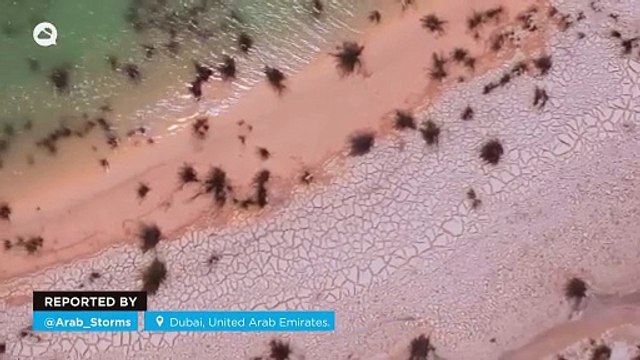 Temporary rivers and lakes appear in the desert after torrential rains in Dubai