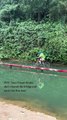 Woman Falls Into Water While Cycling on Narrow Bridge