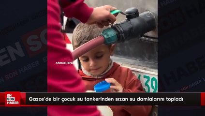 Gazze’de bir çocuk su tankerinden sızan su damlalarını topladı