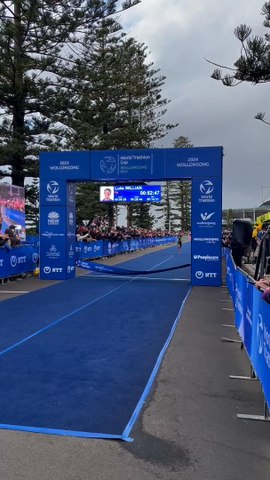 Australia's Luke Willian raises his arms in triumph after winning the elite men's race at the 2024 World Triathlon Cup in Wollongong on Saturday, April 20, 2024. Video by Josh Bartlett