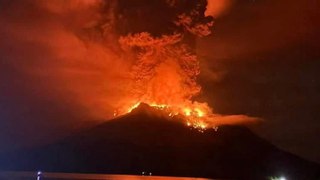 Indonesia: Volcano eruption turns night sky red as lightning strikes around Mount Ruang