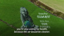 'Vote for climate' - artists paint UK hillside for Earth Day