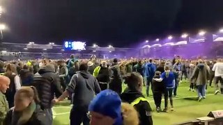 Fans storm the pitch after Pompey win
