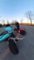 Rider Falls with Her Motorcycle as Her Foot Fails to Reach Ground
