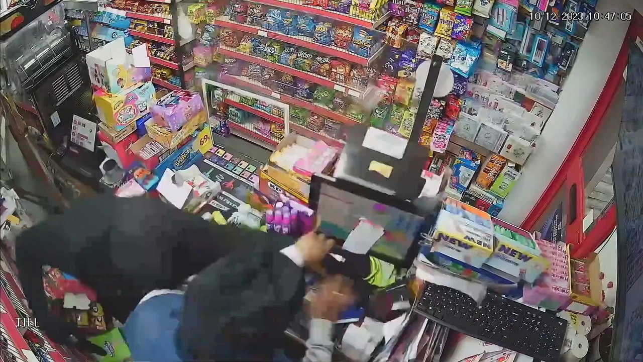 "Watch shopkeeper fight back against armed robber"