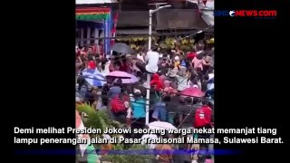 Pria Nekat Panjat Tiang Lampu Penerangan Demi Melihat Presiden Jokowi