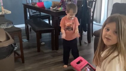 Mischievous boy can't resist the urge to crack a few eggs on the floor
