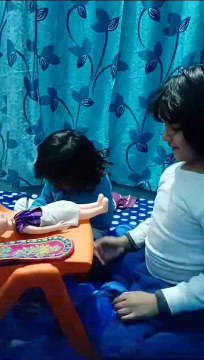 Akshu Trishu playing with doll |mar24