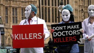Masked medics join anti-euthanasia protest outside parliament