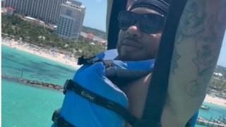 Unexpected parasailing fail leaves man hanging in mid-air