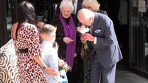King and Queen exchange flowers and presents with children as Charles resumes public duties
