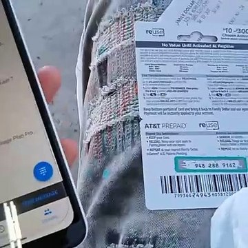 showing people how to use a prepaid card to transact the prepaid to your phone
