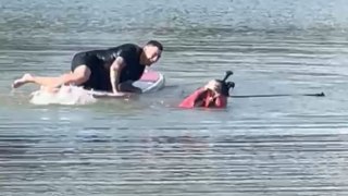 Couple's paddleboarding adventure turns into swimming event after they can't stop falling into the water
