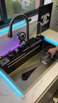 Upgrade your kitchen with this exquisite waterfall sink, combining style and functionality effortlessly.