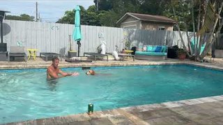 Dog Jumps Alongside Owner Into Pool