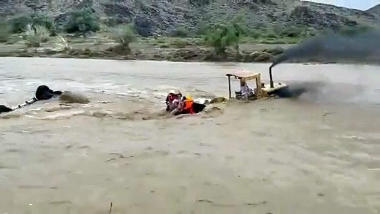 Dramatic excavator rescue from the flooded River
