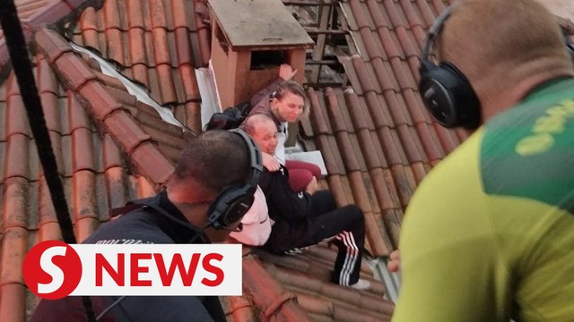 Police pluck victims from roof as floods sweep south Brazil