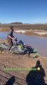 Man Falls Into Water While Trying to Ride Snowmobile on It
