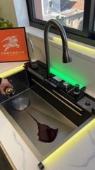 Enhance your kitchen with a stunning waterfall-style kitchen sink.