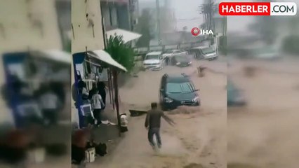 Cizre'de suya kapılan kadın ve çocuğu vatandaşlar kurtardı... Korku dolu anlar kamerada