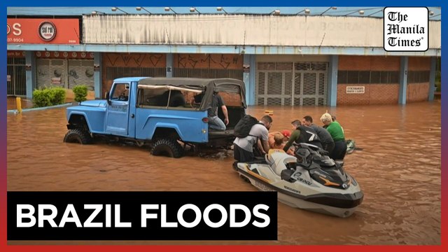 Brazilian volunteers rush to rescue people stranded by deadly floods