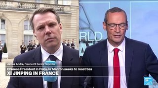 France's Macron shakes hands with China's Xi at Elysee Palace
