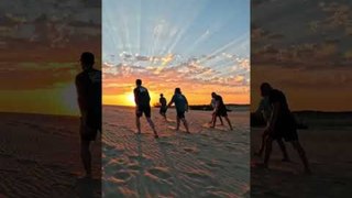 Friends Gather at Beach to Witness Beautiful Sunset
