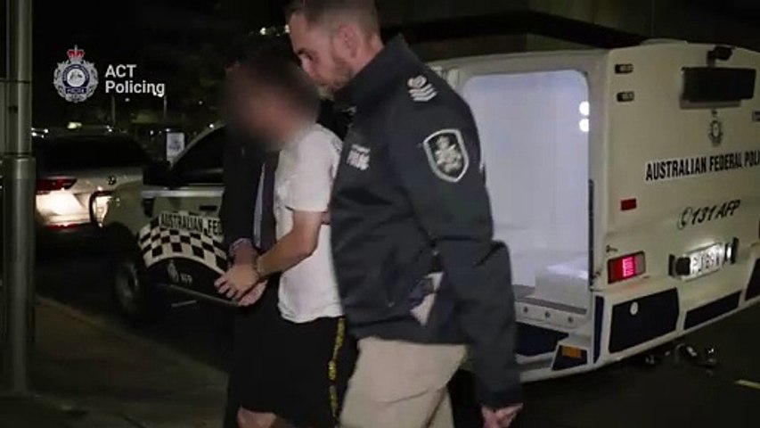 Police in Canberra arrest Zheming Zhang, 22, who is accused of a virtual kidnap scam and impersonating a police officer.
