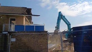 Tom Casey explains the demolition process as work starts on houses in Maidstone