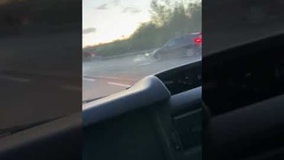 Pickup Truck Driving Dangerously Down the Road Drops Cargo Onto Oncoming Traffic