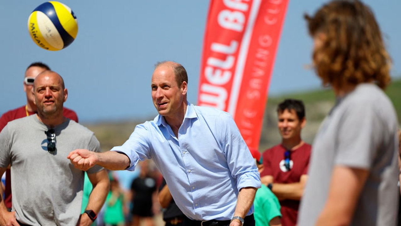 Prince William joins in volleyball game with children on Cornwall beach