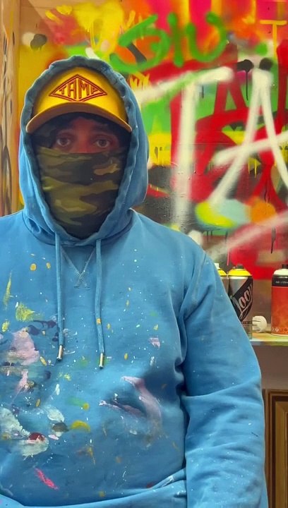 Singer-songwriter Jamie T signs an acoustic guitar which will be auctioned for Sussex charity