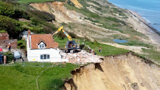 Farmhouse left hanging over perilous cliff edge demolished