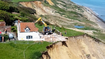 Farmhouse left hanging over perilous cliff edge demolished