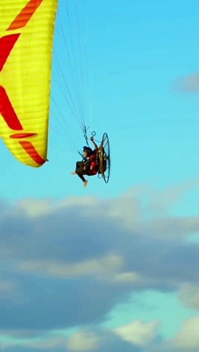 Paramotor crossing the Haulover Inlet into the Haulover beach in Miami, Florida