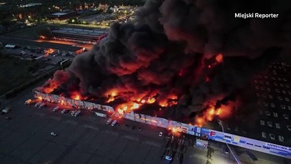 Flames engulf a Polish shopping center