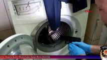Çamaşır makinasına gizledikleri silahlarla yakalandılar