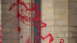 Protestors daub Manchester University in red paint