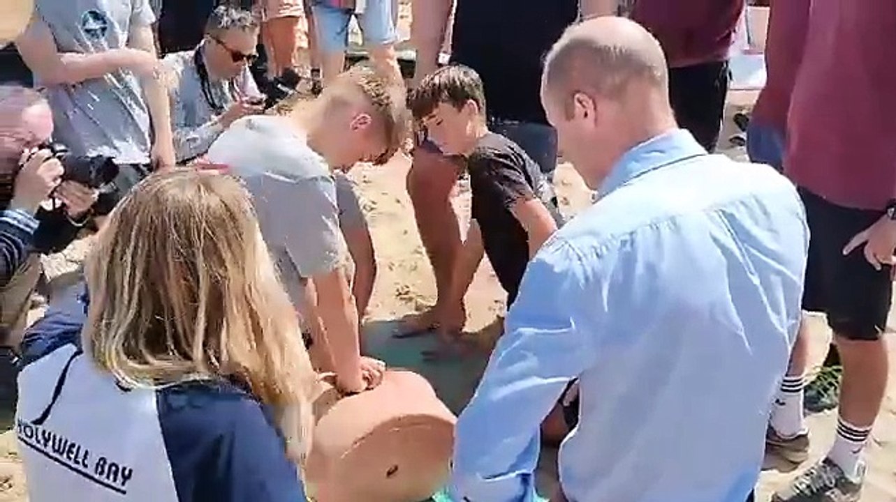 Prince William oversees a surf life saving club resusitation exercise at Fistral Beach