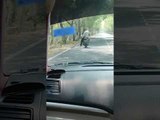Cleaner Rides on Motorcycle to Sweep Road Effortlessly