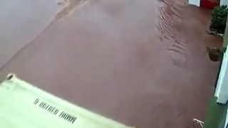 A container floats away in the floods at Skenfrith